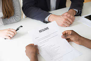 African-american applicant holding resume at job interview, clos